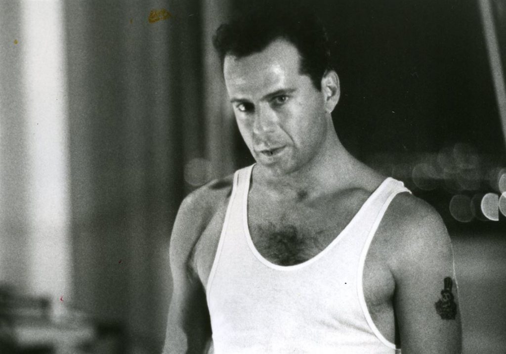 Bruce Wills Wearing Tank Top in a Movie