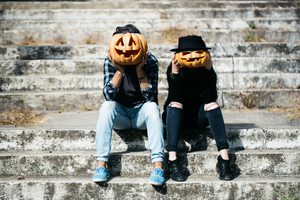 Young Couple With Spooky Pumpkin