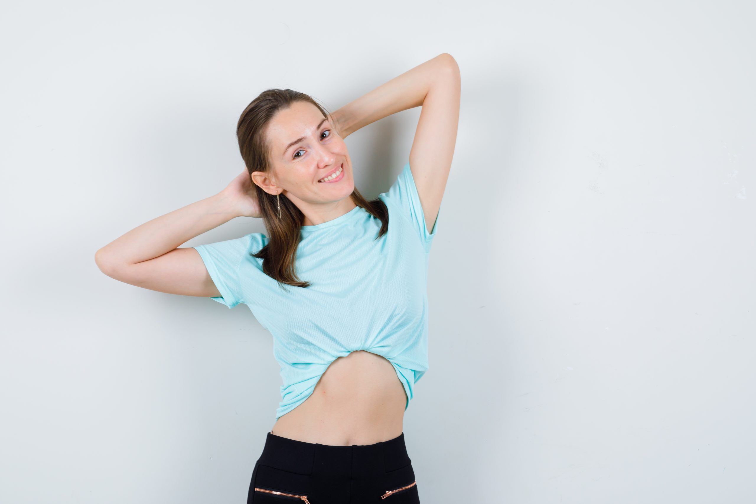 https://blog.tshirtplus.com.au/wp-content/uploads/2023/01/young-girl-with-hands-head-turquoise-t-shirt-pants-looking-cheerful-front-view-scaled.jpg