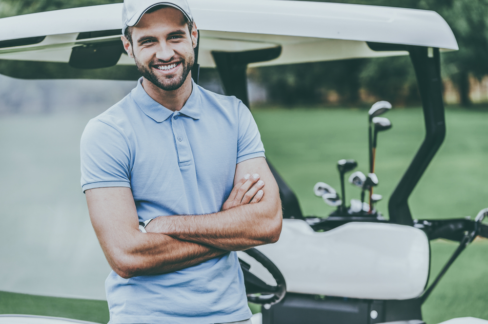 Man wearing polo on golf course
