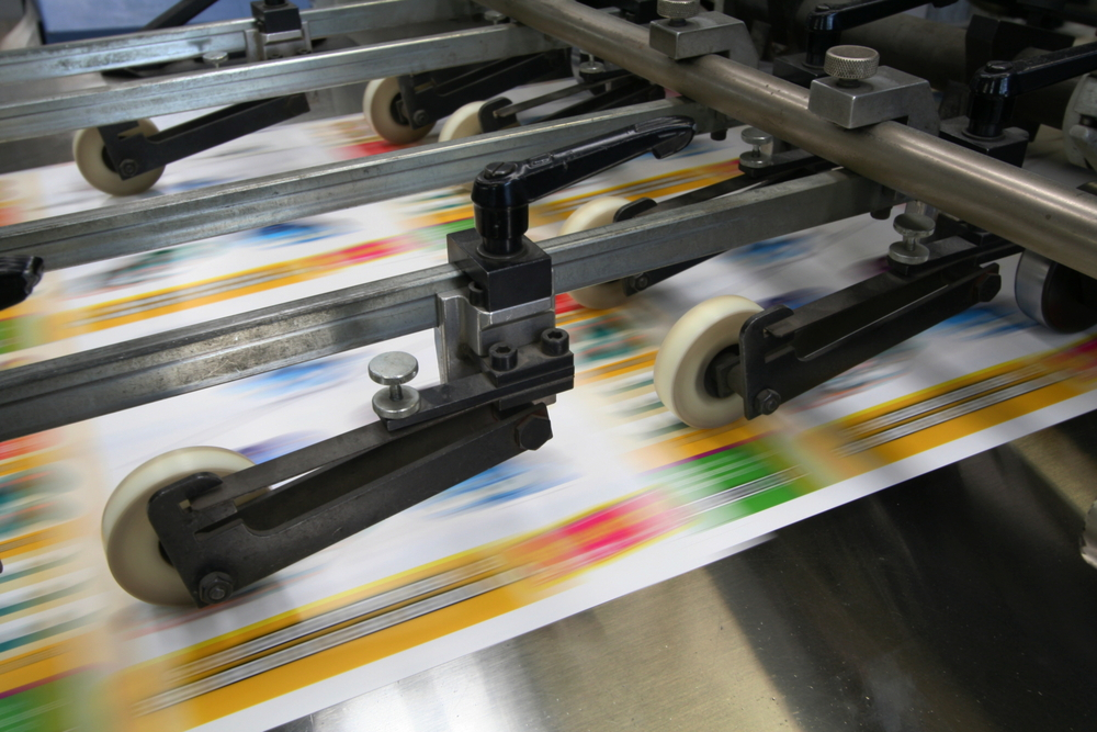 A Working Printing Machine on Printing Plates